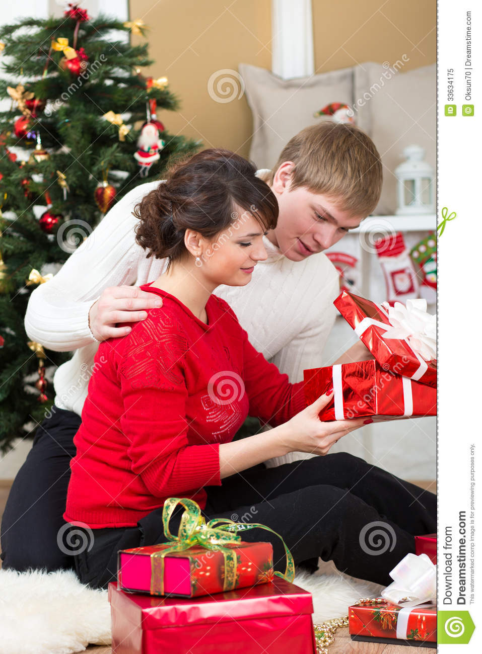 Gift Ideas For Young Couples
 Young Couple With Gifts In Front Christmas Tree Royalty