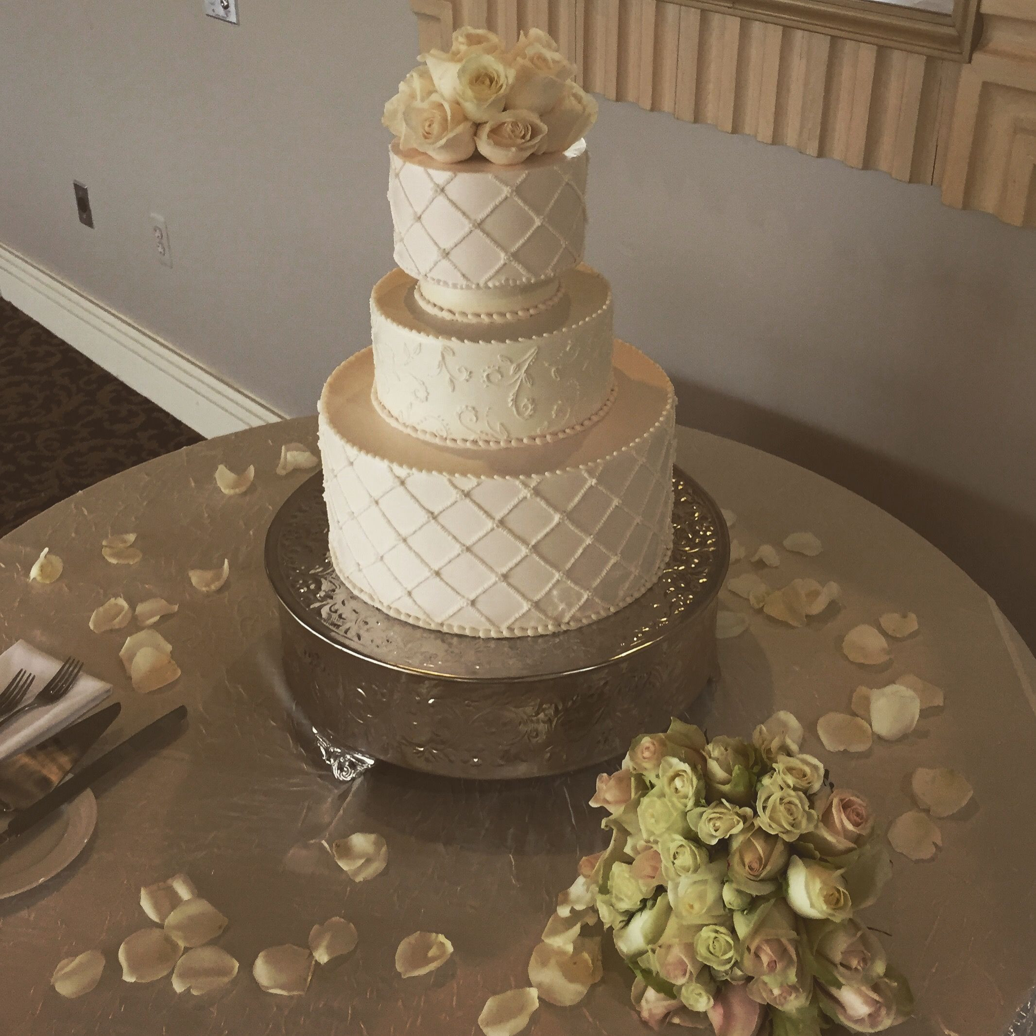 Holiday Market Wedding Cakes
 Elegant lattice buttercream design with scroll and fresh