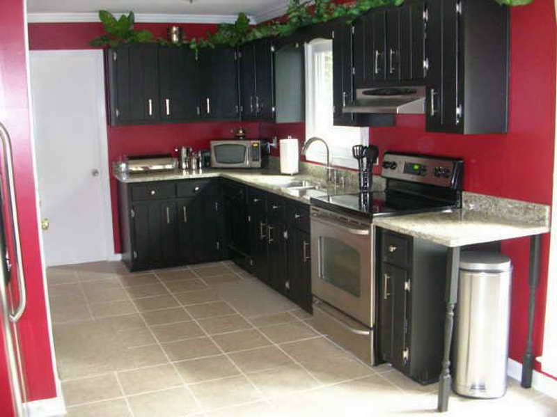 Kitchen With Red Wall
 Black Painted Kitchen Cabinets with red walls I love the