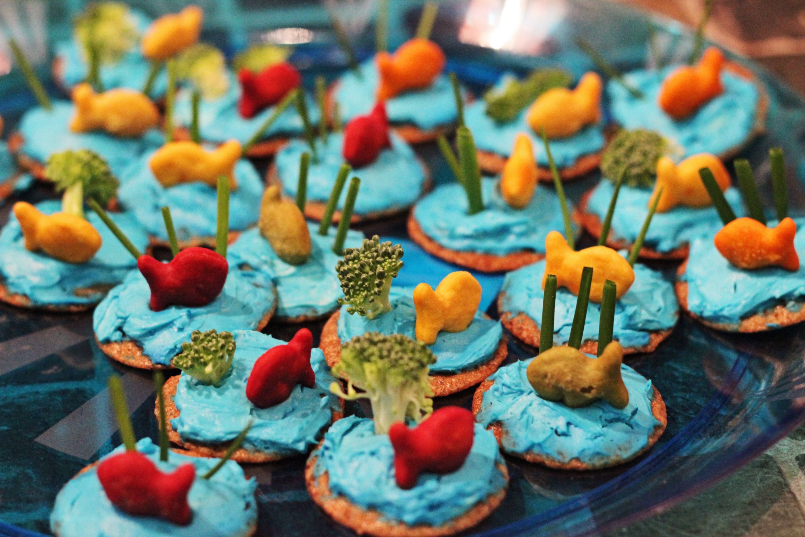 60S Beach Party Food Ideas
 Tinted cream cheese is spread on Ritz cracker with
