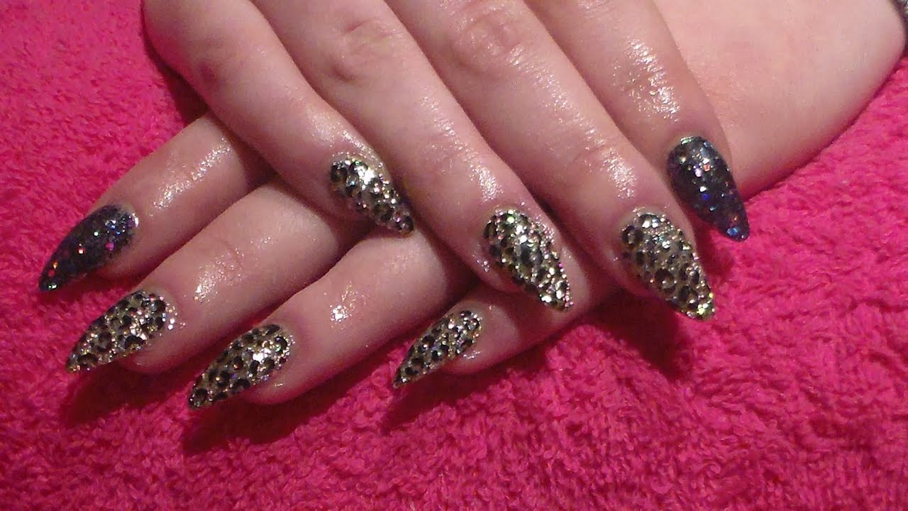 Black And Gold Glitter Nails
 Black and Gold Glitter with leopard print Acrylic nails