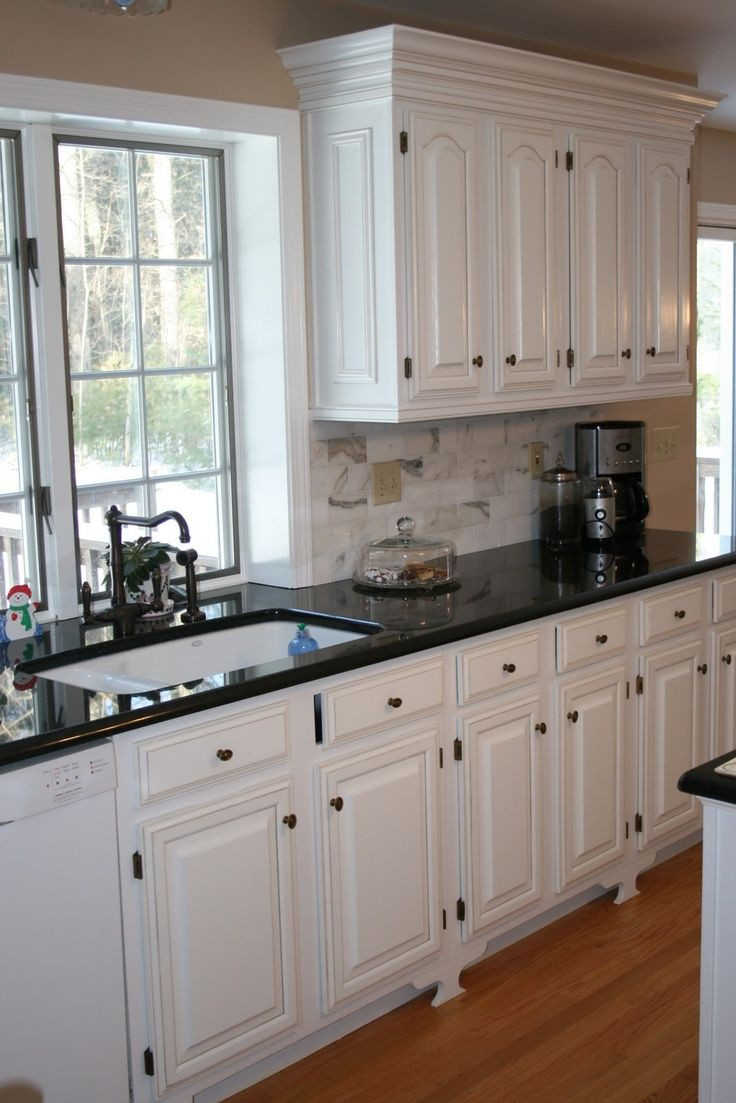 Black And White Kitchen Cabinets
 White Kitchens with Black Countertops