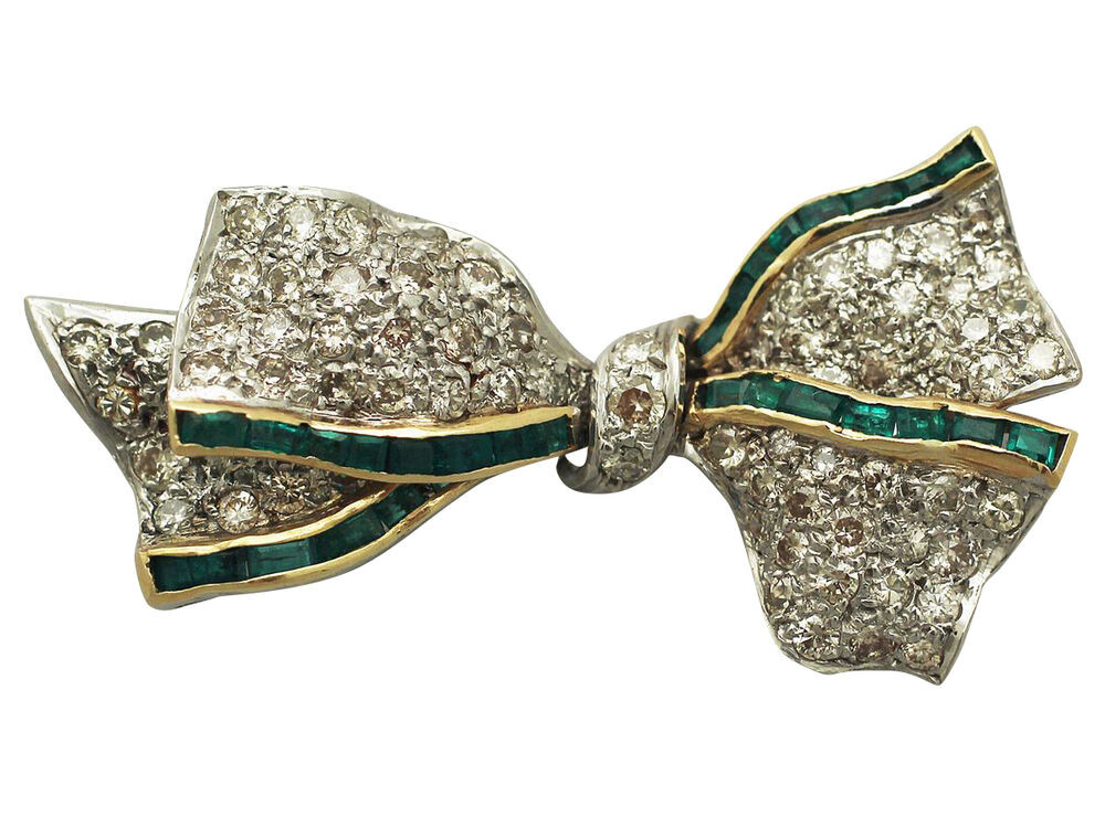 Bow Brooches
 1 31ct Diamond & 0 52ct Emerald 18ct White Gold Bow