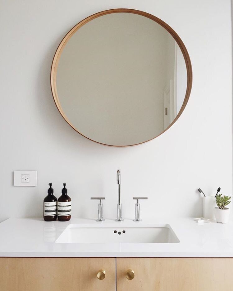 Circular Bathroom Mirror
 Round mirror in minimalistic bathroom