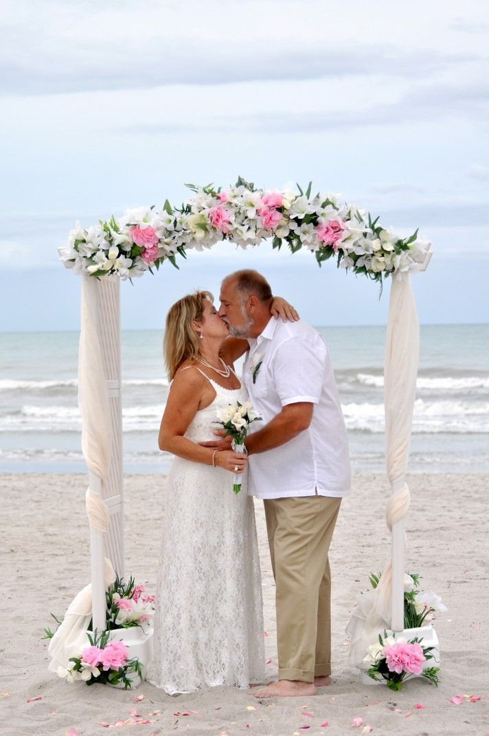 Cocoa Beach Weddings
 Married under a beautiful wedding arch on the beach in