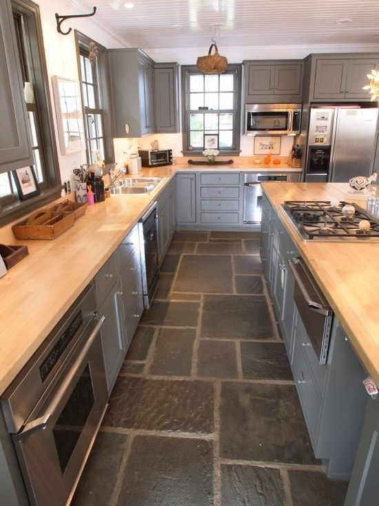 Dark Tile Kitchen Floor
 High gloss cabinets contrast with slate floor