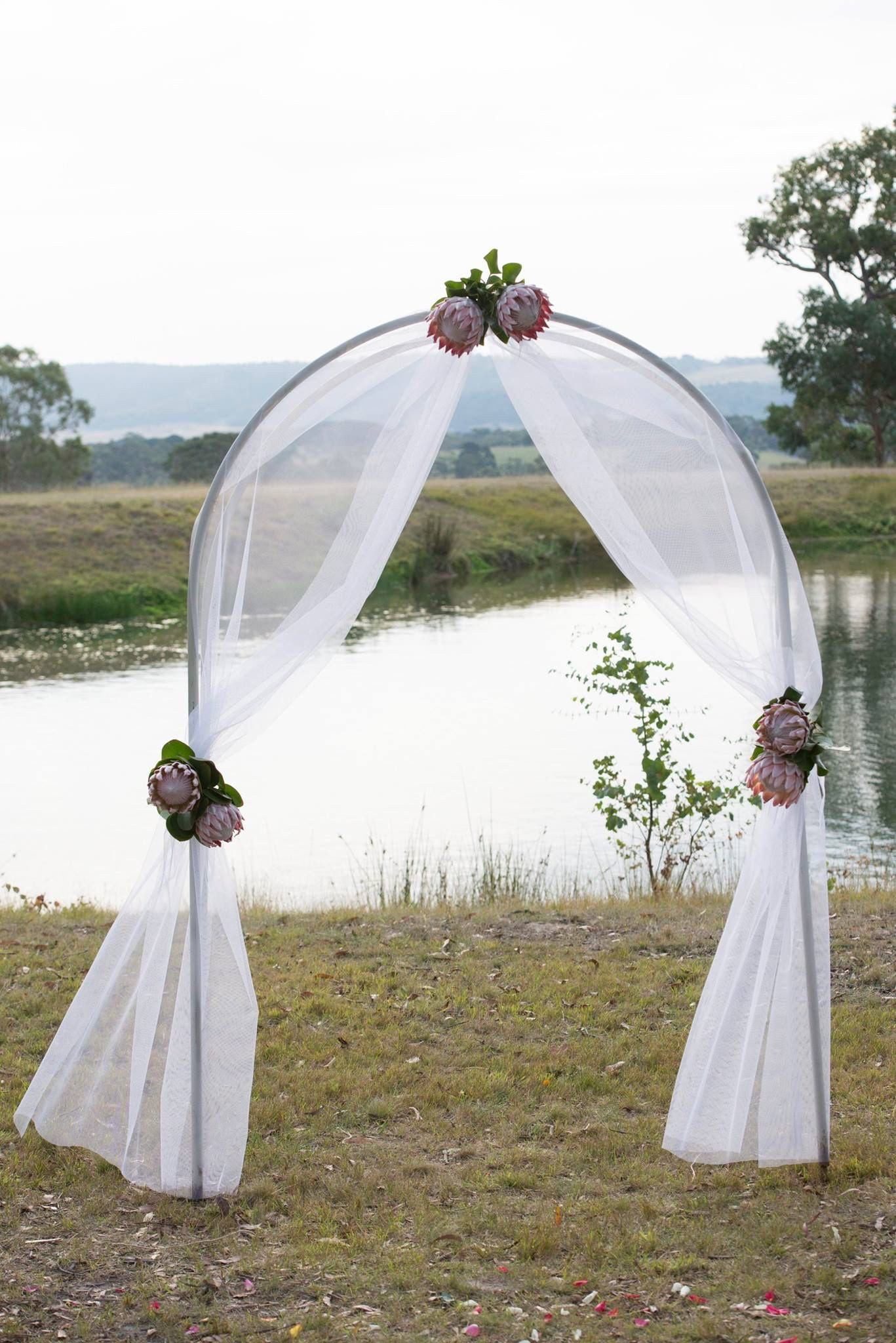 Decorating A Wedding Arch
 Gorgeous ceremony Arch decorated with tulle and King