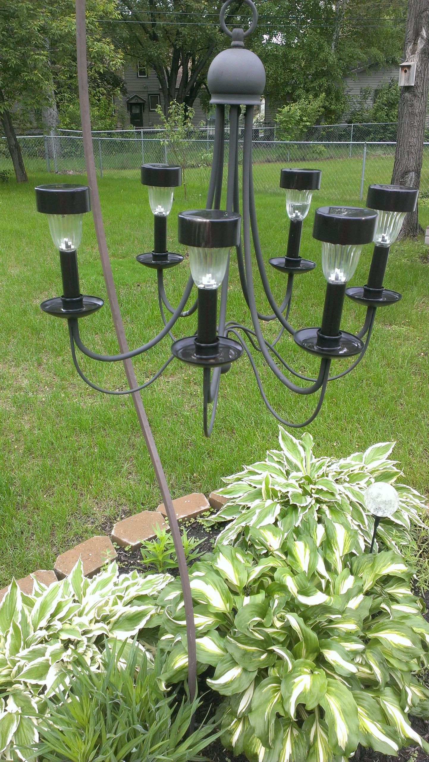 DIY Outdoor Chandelier With Solar Lights
 Repurposed a chandelier from a thrift shop into a outdoor