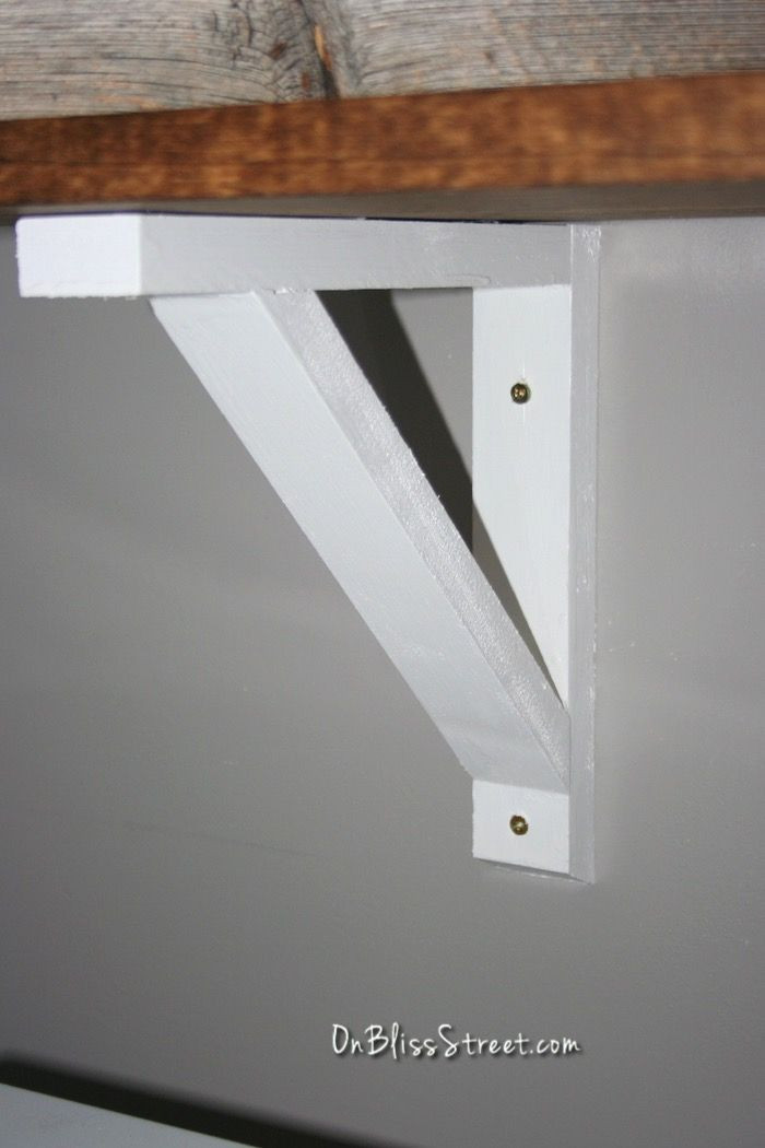 DIY Shelving Brackets
 White DIY shelf bracket installed onto gray wall