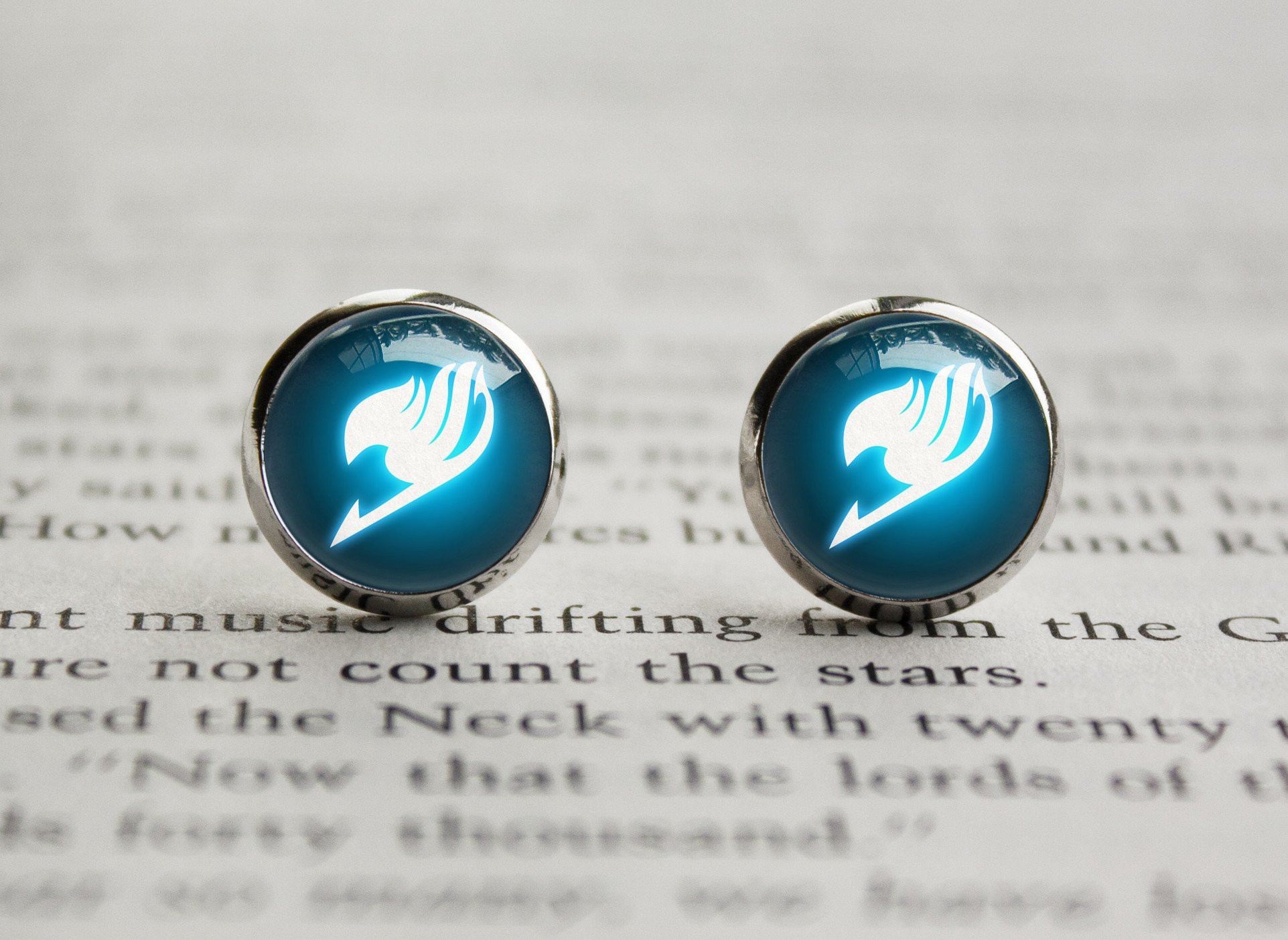 Fairy Tail Earrings
 Fairy Tail glowing guild emblem earrings – Trinket Geek