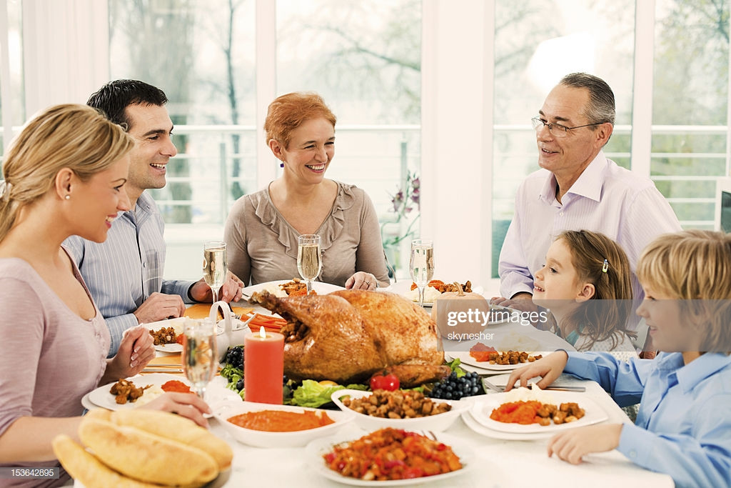 Family Thanksgiving Dinner
 Extended Family Having Thanksgiving Dinner Stock