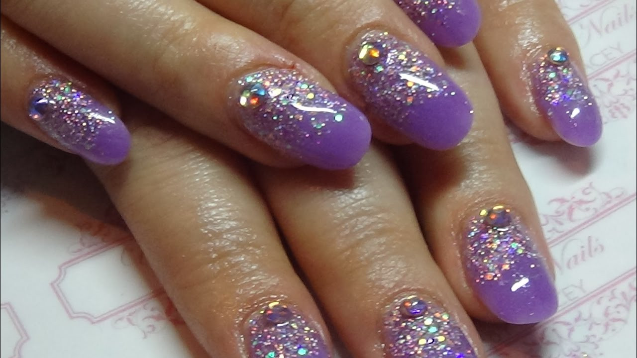 Glitter Purple Nails
 Purple acrylic nails with a glitter overlay using cjp