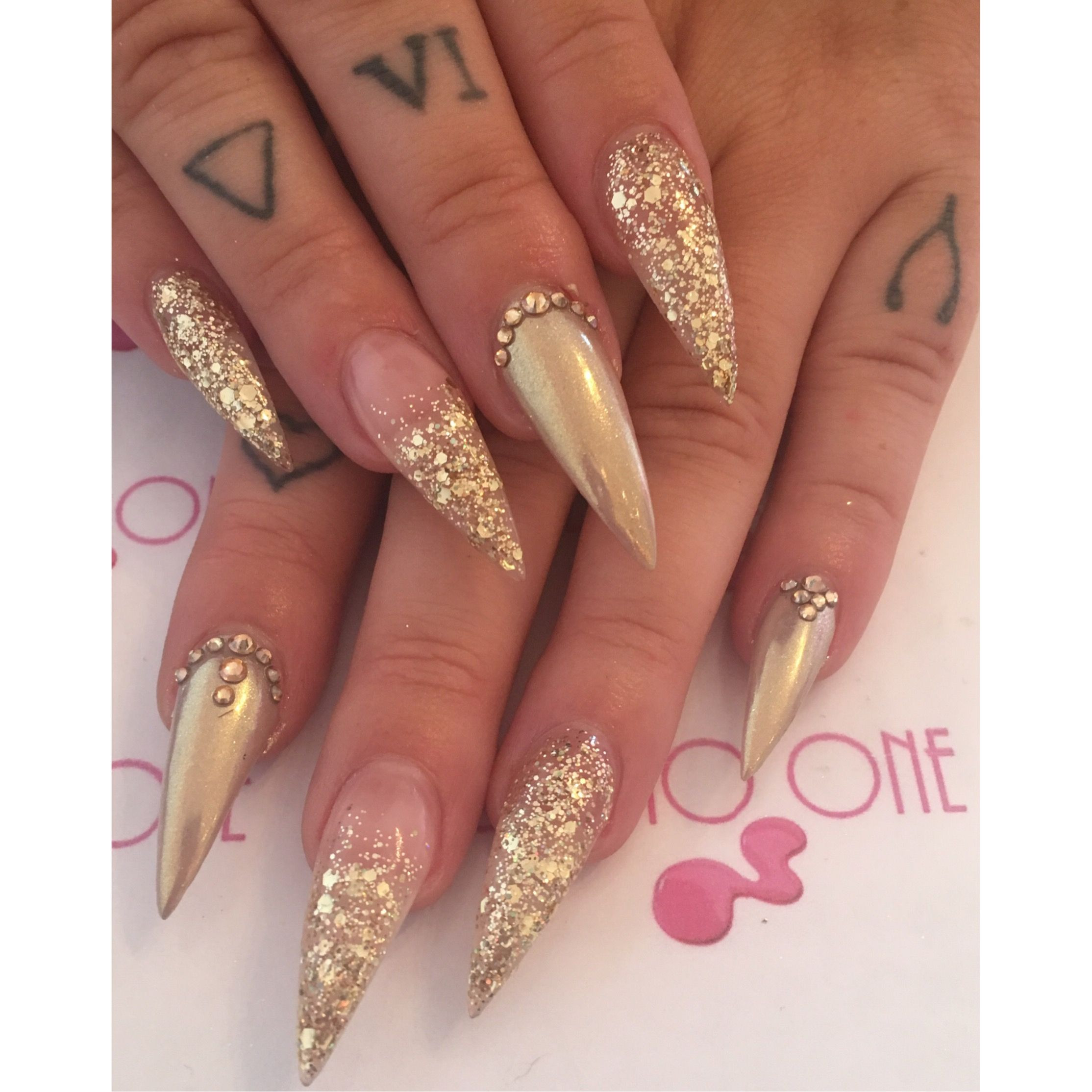 Gold Glitter Acrylic Nails
 Gold gems chrome chunky glitter stiletto nails tattoo glam