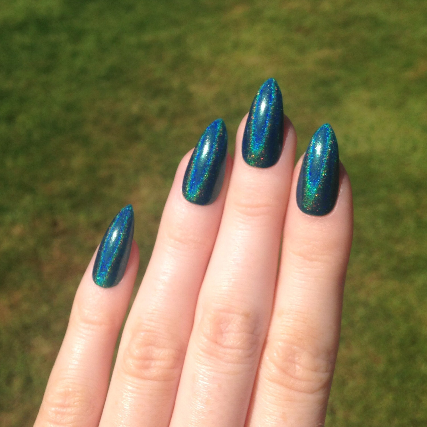 Holographic Nail Art
 Holographic teal stiletto nails Nail designs by
