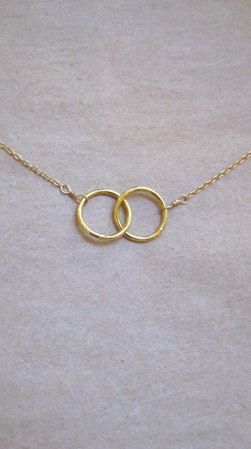 Interlocking Circle Necklace
 two interlocking gold circles necklace by studioro on Etsy