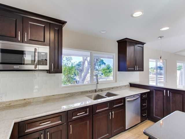 Kitchen Backsplash For Sale
 Dark cabinets with white glass subway tile backsplash and