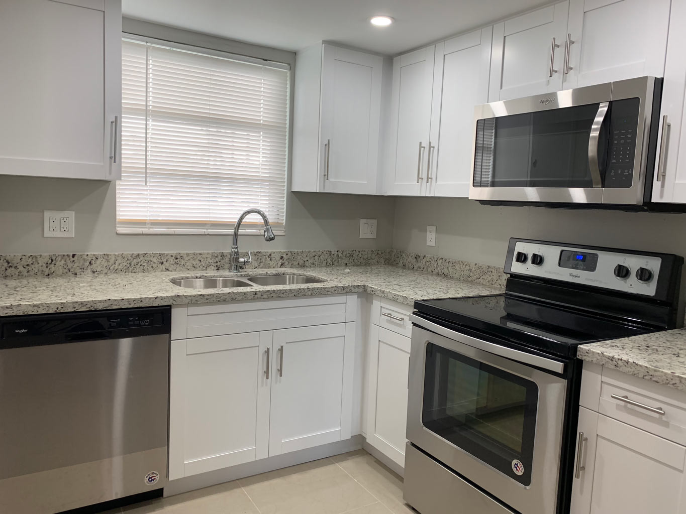 Kitchen Remodeling White Cabinets
 Small Kitchen Remodel with White Shaker Cabinets — Miami