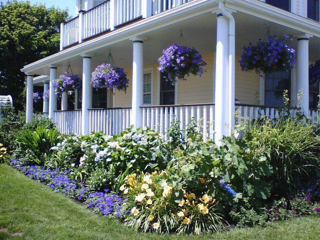 Landscape Around Front Porch
 Love the house the purple hanging baskets are perfect