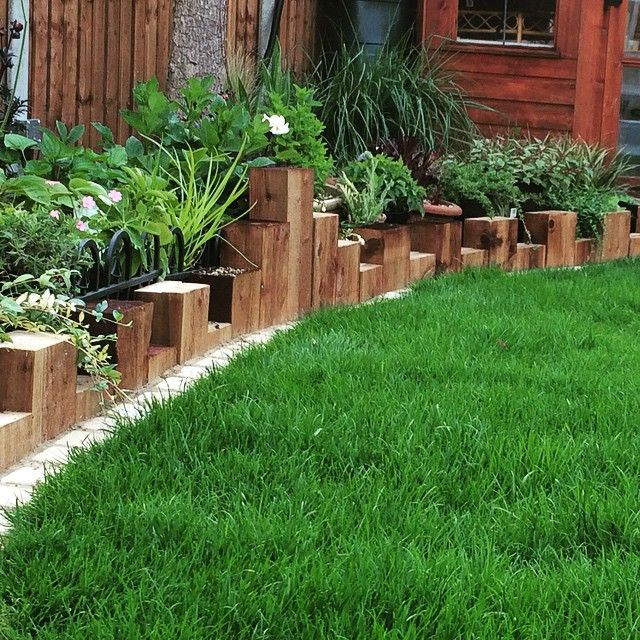 Landscape Timber Edging Ideas
 Vertical sleeper planting bed edging Tomoco landscaping