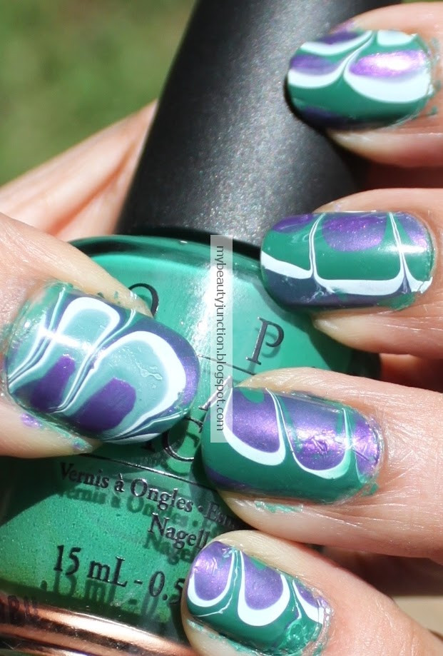 O.p.i Nail Art
 Water marbling nail art with O P I polishes and tips and