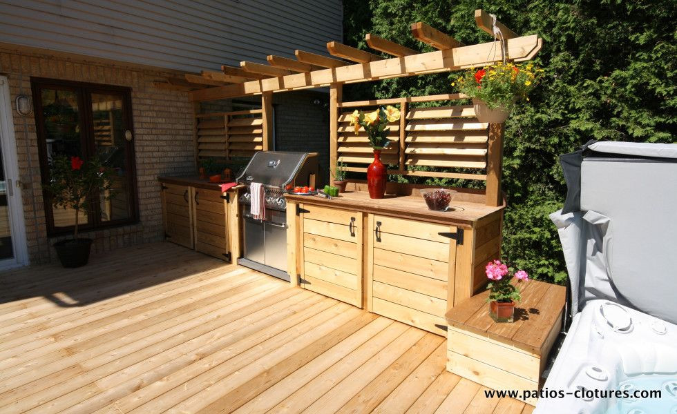 Outdoor Kitchen On Wood Deck
 Beautiful Outdoor Kitchen Area with BBQ and Louvered Fence