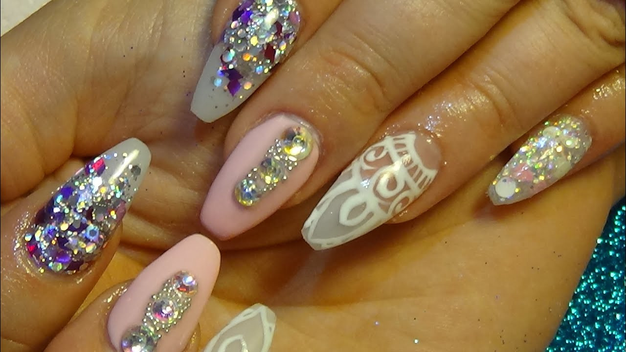 Pretty Acrylic Nails
 beautiful pink & glitter acrylic nails with hand painted