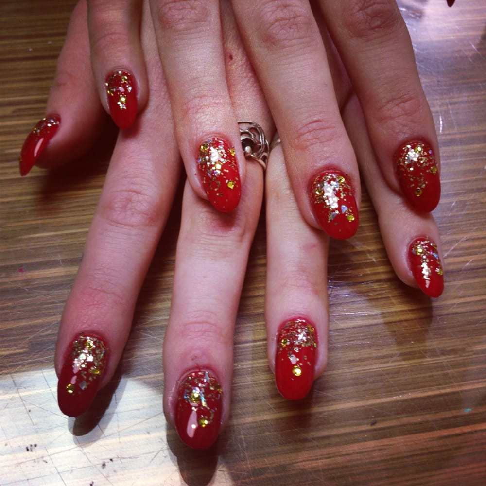 Red And Gold Glitter Nails
 Gold glitter over red acrylic nails