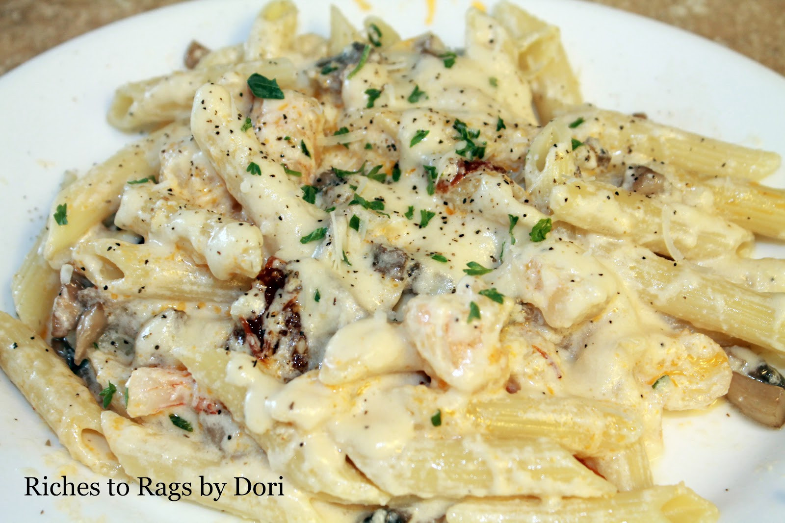 Shrimp And Penne Pasta Alfredo
 Riches to Rags by Dori Creamy Alfredo Pasta with Shrimp
