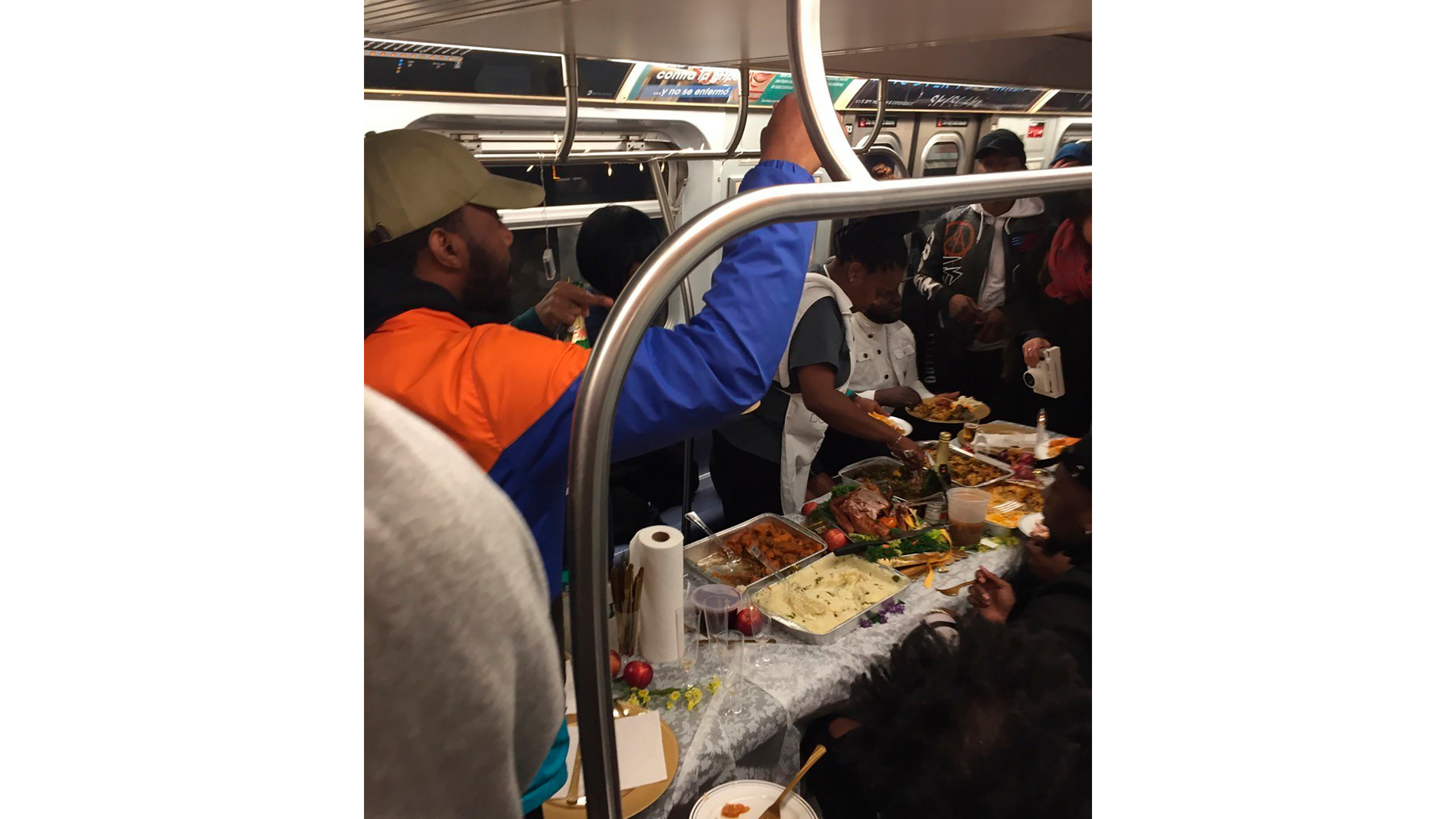 Thanksgiving Dinner New York City 2020
 NYC muters enjoy Thanksgiving feast on subway car