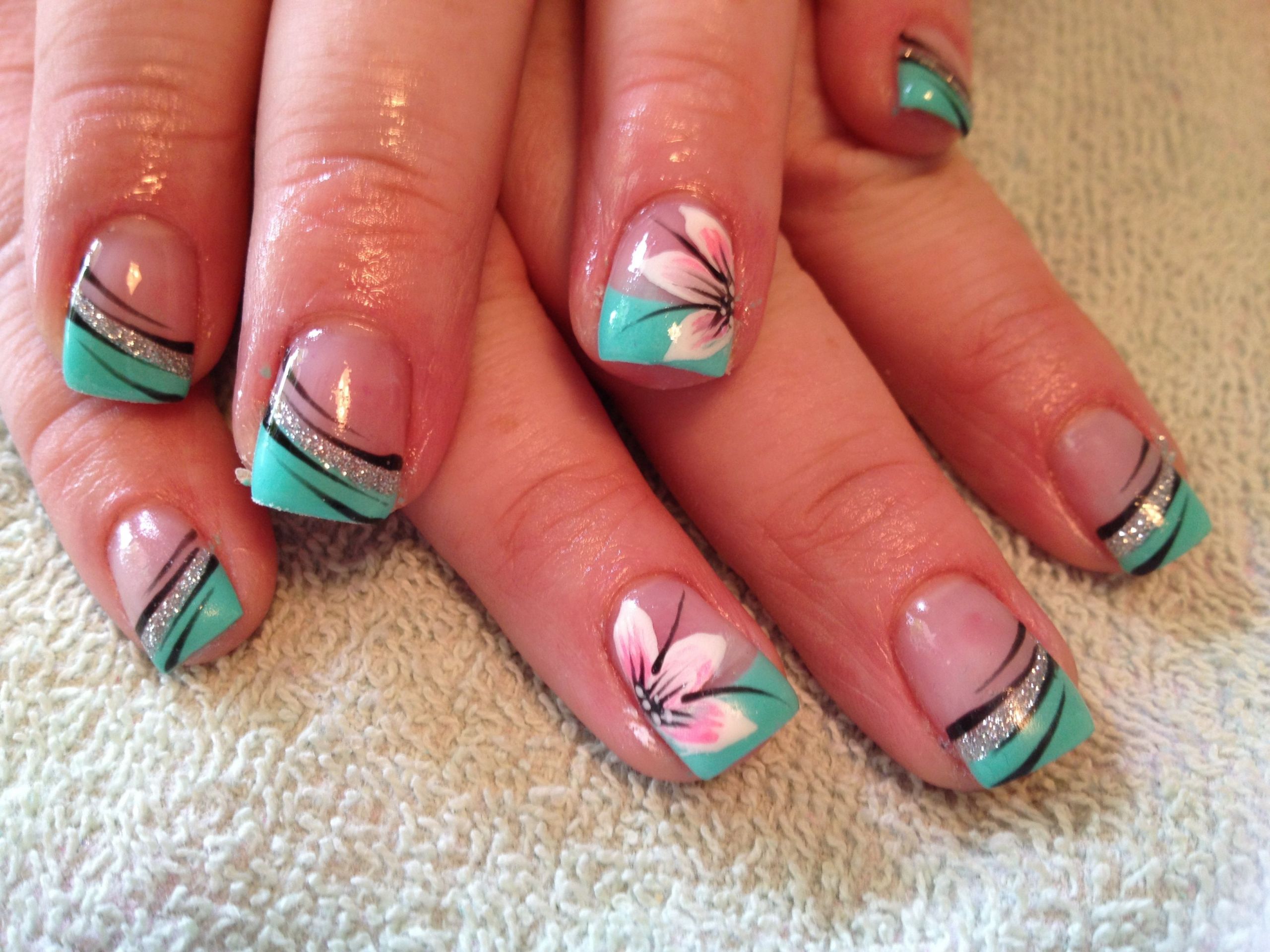 Turquoise Nail Ideas
 Turquoise nails with flowers