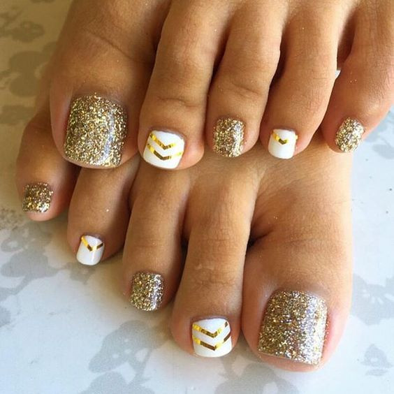 White Nails With Gold Glitter
 Picture gold glitter nails and white ones with gold chevron