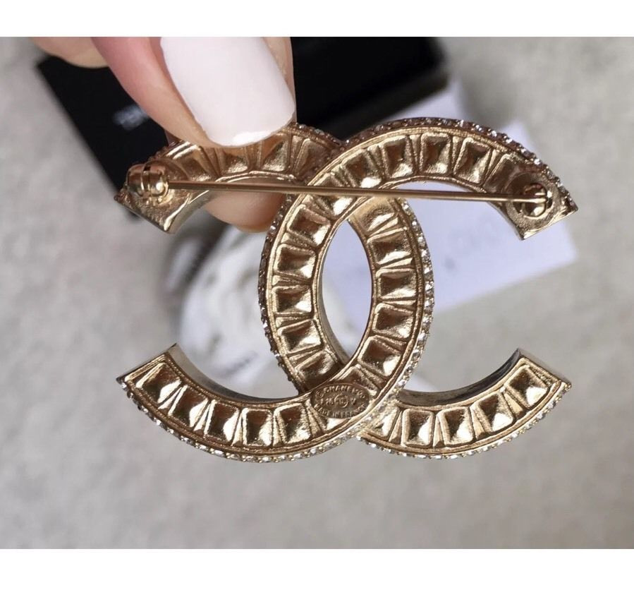 Chanel Brooches
 Authentic Chanel Crystal CC Gold Brooch Pin and 50 similar