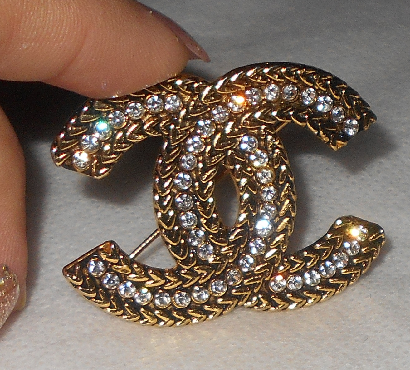 Chanel Brooches
 Please help me is this coco chanel brooch authent